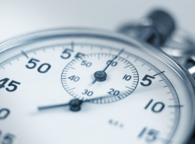 Close up of stopwatch sitting on a table showing seconds.