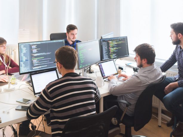 Group of developers in an office working together